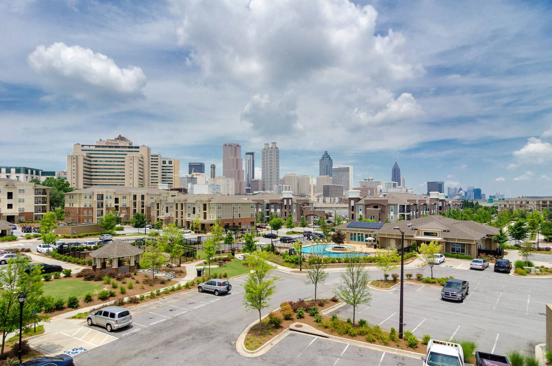 Birds eye view of community with Atlanta skyline in background at Ashley Auburn Pointe in Atlanta, GA Birds Eye View of Property
